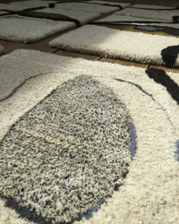 details of one of square rug cream black and navy